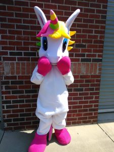Person wearing unicorn costume